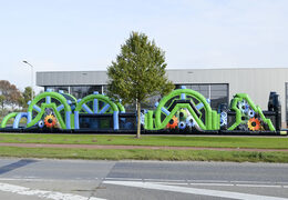 Buy a 30 meter mega obstacle course in the colors black and green for both young and old. Order inflatable obstacle courses now online at JB Inflatables UK