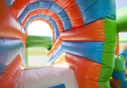 Buy a medium inflatable multiplay bounce house in football theme with slide for children. Order inflatable bounce houses online at JB Inflatables UK