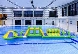 Slide swimming pool adventure run green/blue 16m with challenging obstacle objects and round slide for both young and old. Buy inflatable water attractions online now at JB Inflatables UK