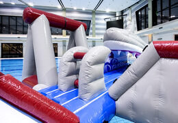 Order an airtight inflatable play island in a shark theme with a liana, climbing tower, round slide and obstacles for both young and old. Buy inflatable pool games now online at JB Inflatables UK