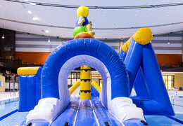 Airtight inflatable surfer play island with a vine, climbing tower, round slide and obstacles for both young and old. Order inflatable water attractions now online at JB Inflatables UK