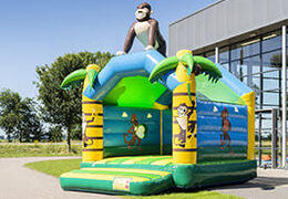 Buy a standard jungle bouncy castle for children in striking colors with a large 3D object in the shape of a gorilla on the top. Order bouncy castles online at JB Inflatables UK