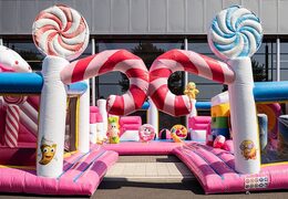 Bounce World Candyland bouncy castle with multiple slides and all kinds of fun obstacles with candyland prints for children. Buy bouncy castles online at JB Inflatables UK