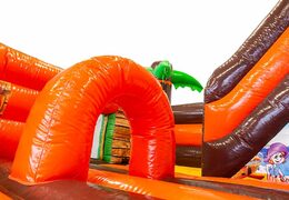 Bounce house in pirate theme with a slide, buy the 3D object on the jumping surface with some fun pirate design for children. Buy bounce houses online at JB Inflatables UK