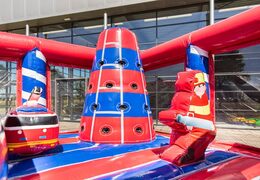 Buy a large Indoor fire brigade bouncy castle with a slide on the jumping surface, climbing tower and fun obstacles with fire-themed prints for kids. Order inflatable bouncy castles online at JB Inflatables UK.