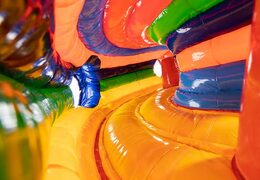 Circus themed inflatable crawl tunnel with obstacles, use a climbing ramp and slide for children. Buy bouncers online at JB Inflatables UK