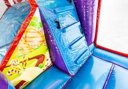 Multiplay XXL Candyland bounce house in a unique design, a slide and 3D objects for children. Buy bounce houses online at JB Inflatables UK