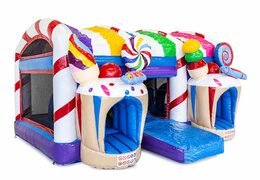 Candyland themed bouncy castle with a slide and 3D objects for children. Order bouncy castles online at JB Inflatables UK