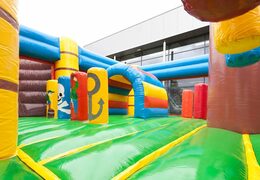 Pirate boat themed bouncer with a slide and 3D objects for children. Order bouncers online at JB Inflatables UK