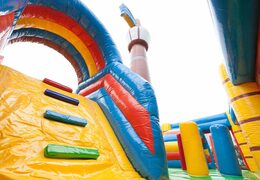 Large inflatable indoor pirate boat multiplay bouncer with slide in Lego theme for kids. Buy bouncers online at JB Inflatables UK