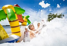 Open Bubble park Hawaii with a foam tap for kids to use. Order inflatable bouncers at JB Inflatables UK