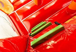 Indoor multiplay fire brigade bouncer in a unique design with two entrances, a slide in the middle and 3D objects for kids to order. Buy bouncers online at JB Inflatables UK