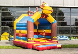 Buy a standard bouncy castle in striking colors and with a large 3D object of a monkey on top for children. Order bouncy castles online at JB Inflatables UK