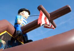 Buy shooting combo pirate bouncy castle with cover, shooting game and slide for kids. Order bouncy castles online at JB Inflatables UK