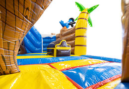 Pirate-themed bounce house with treasure chest