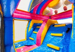 Climbing wall of Multiplay dubbelslide unicorn theme blue yellow pink