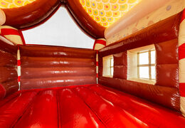 Jumping in the Multifun Gingerbread theme bouncy castle for sale at JB Meppel