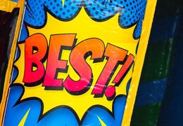 Buy the A-frame Super Comic bouncy castle with Comic strips design, perfect for rental companies