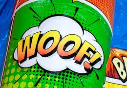 Inflatable A-frame Super Comic bouncy castle in Comic theme, ideal for events and parties