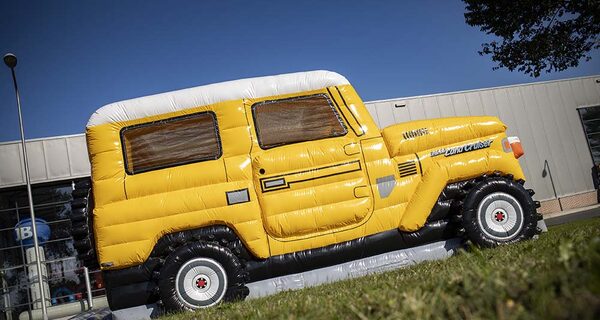 Personalized Toyota Land Cruiser Autobedrijf van der Linde bouncy castle made in your own corporate identity at JB Promotions UK. Order online promotional bouncy castles in all shapes and sizes