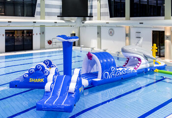 Inflatable 13 meter long shark run swimming pool obstacle course in a unique design with funny 3D objects and no less than 2 slides for both young and old. Order inflatable obstacle courses online now at JB Inflatables UK