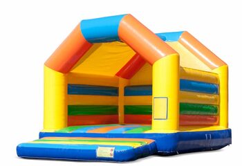 Buy a large indoor bounce house in the colours yellow, orange, green and blue for children. Order bounce houses online at JB Inflatables UK