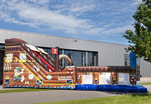 Mega inflatable slide in Pirates world theme with 3D obstacles for children. Buy inflatable slides now online at JB Inflatables UK