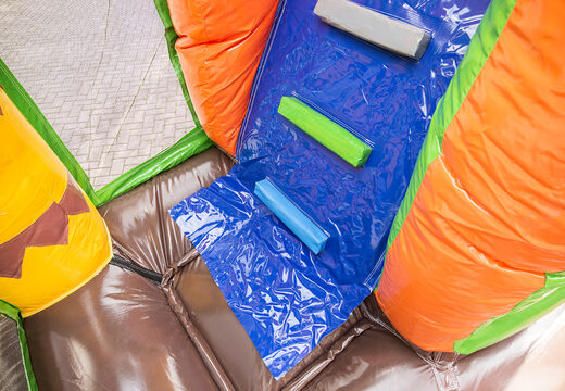 Multiplay Dinoworld bounce house with a slide, fun objects on the jumping surface and striking 3D objects for kids. Buy inflatable bounce houses online at JB Inflatables UK