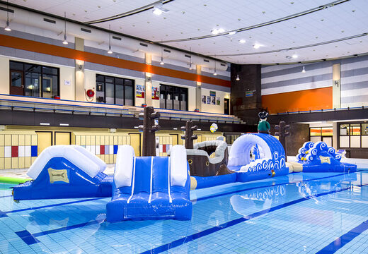 Inflatable double obstacle course 16 meter long pirate run swimming pool obstacle course in a unique design with funny 3D objects and no less than 2 slides for both young and old. Order inflatable pool obstacle courses now online at JB Inflatables UK