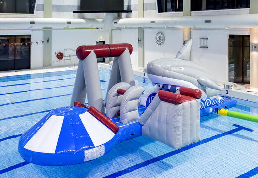 Order an inflatable airtight shark play island with a vine, climbing tower, round slide and obstacles for both young and old. Buy inflatable water attractions online now at JB Inflatables UK