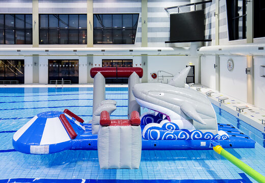 Buy an airtight shark inflatable play island with a vine, climbing tower, round slide and obstacles for both young and old. Order inflatable water attractions now online at JB Inflatables UK