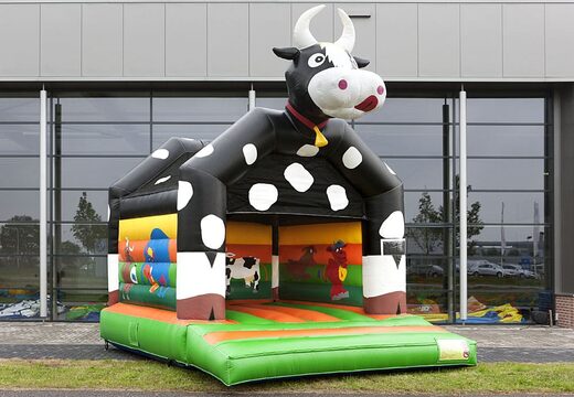 Order a standard bouncer in striking colors with a large 3D object of a cow on top for children. Order bouncers online at JB Inflatables UK