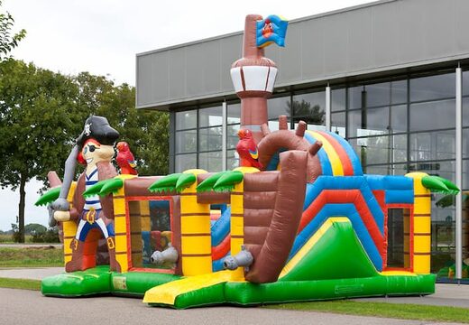 Indoor multiplay XXL Pirate boat bouncy castle in a unique design, a slide and 3D objects for children. Order bouncy castles online at JB Inflatables UK