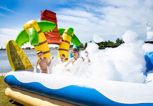 Buy an inflatable large bubble park in Hawaii theme for kids. Order inflatable bouncy castles at JB Inflatables UK