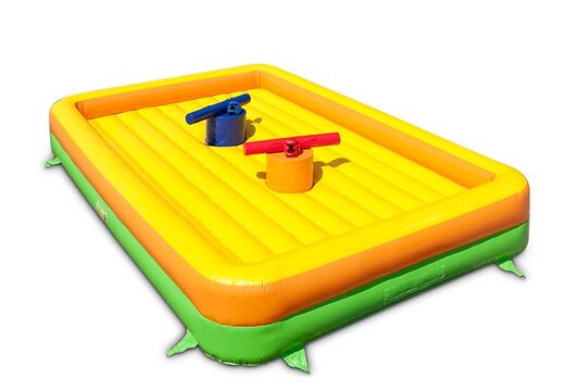 Gladiator play against each other on bouncy castle