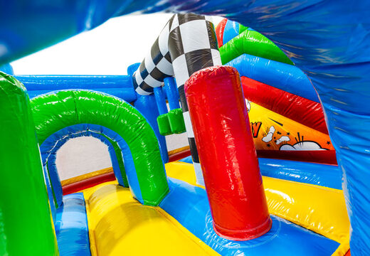 Green and blue arches and red pillars in multiplay bouncy castle Comic