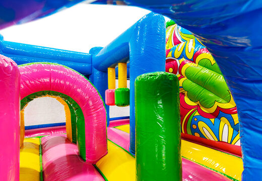 Pink arches and green pillars colorful interior of Multiplay Ibiza