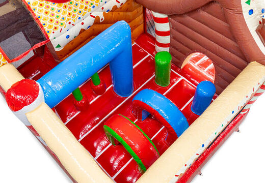 Inside of Multiplay inflatable bouncy castle with arches, pillars, and punching bags