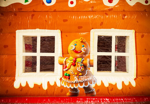 Illustration of a gingerbread figure and windows on Multifun JB bouncy castle